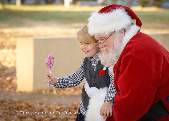 Santa poses with small boy
